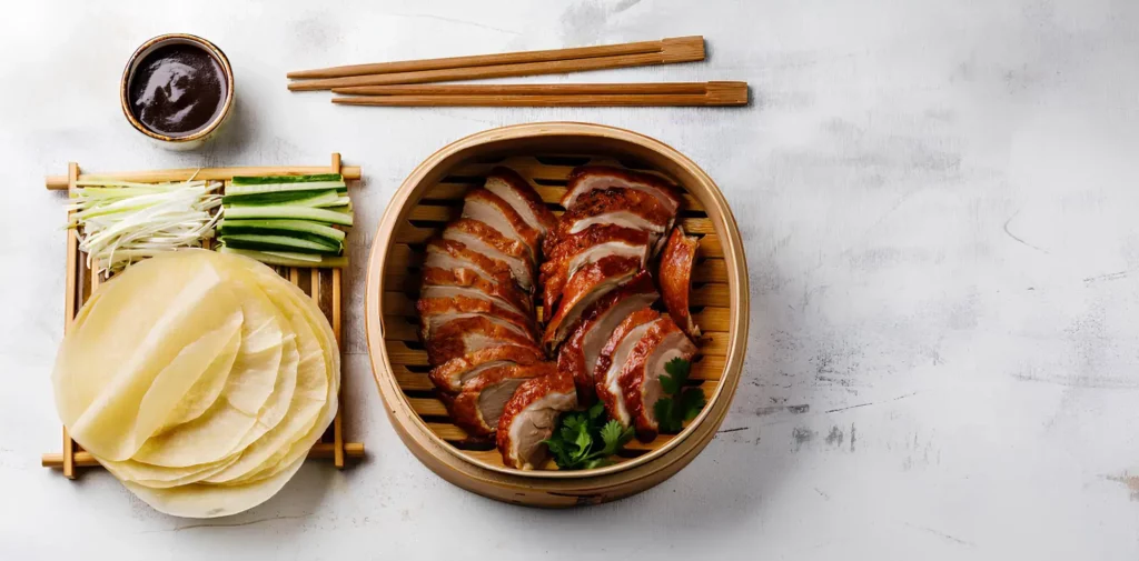 Peking Duck recipe, How to make Peking Duck, Chinese roast duck, Crispy duck skin, Homemade Peking Duck, Authentic Peking Duck, Beijing roast duck, Best Peking Duck recipe, Traditional Peking Duck, Easy Peking Duck recipe, Peking Duck sauce, Peking Duck marinade, Mandarin pancakes for Peking Duck, Hoisin sauce for Peking Duck, How to roast a whole duck, Chinese five-spice duck, Roasted duck with crispy skin, Carving Peking Duck, Duck roasting techniques, Peking Duck history, Air-drying duck for crispy skin.